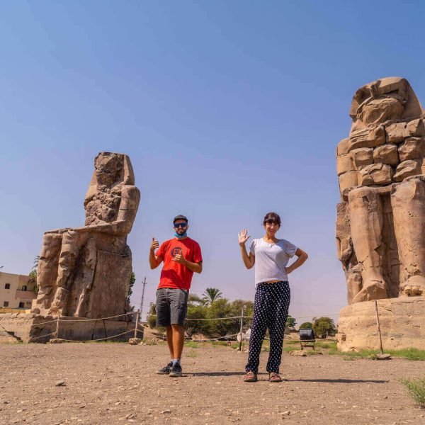 A-picture-of-a-couple-from-their-visit-to-the-two-statues-of-Memnon-in-Luxor