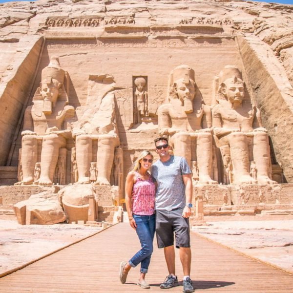 a-stunning-shot-of-a-couple-in-front-of-the-facade-of-the-great-temple-of-abu-simbel-in-aswan