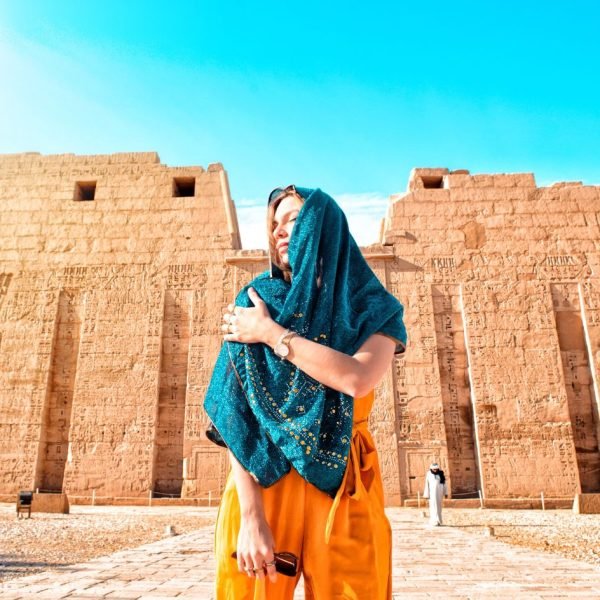 a-stunning-shot-of-a-girl-in-front-of-the-temple-of-habu